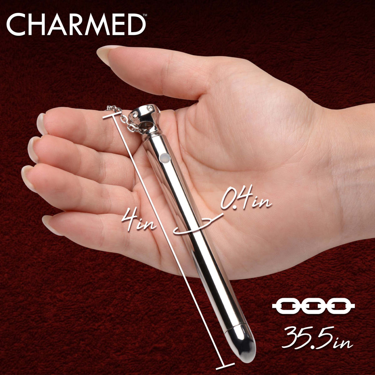 Charmed 7X Vibrating Necklace Silver held in hand, showcasing its sleek design and measurements.