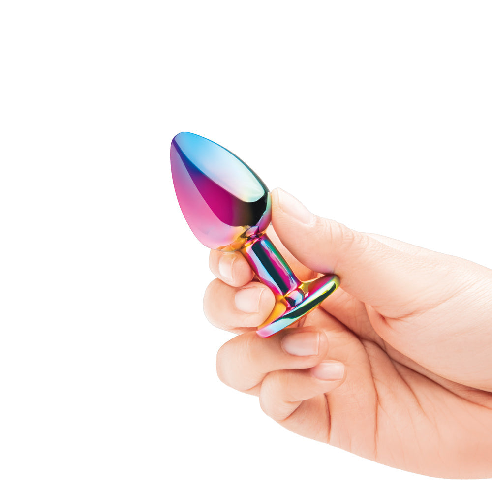 B-vibe Essentials 2-piece Rainbow Bling Anal Training Set in hand, showcasing the colorful design.
