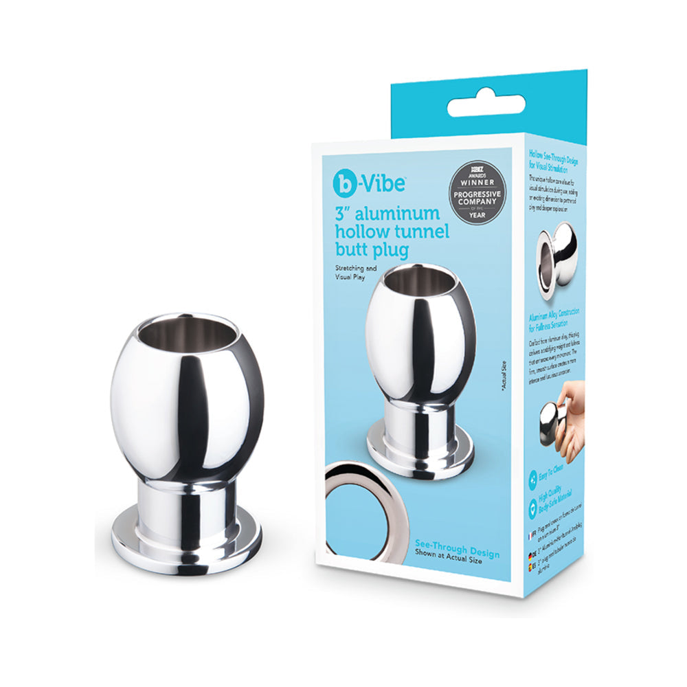 B-vibe Essentials 3 Inch Aluminum Hollow Tunnel Butt Plug displayed with packaging for anal play.