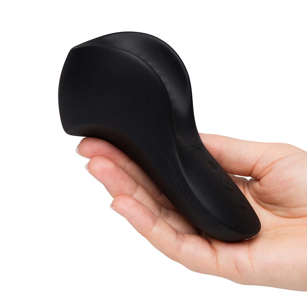 We-Vibe Shared Touch Rechargeable Vibrator Black held in hand, showcasing its ergonomic design and sleek finish.