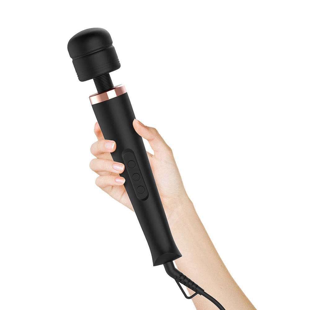 Adam & Eve Magic Massager Ultimate Plug-In Wand held in hand, showcasing its sleek design and control buttons.