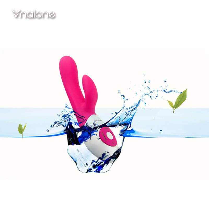 Nalone Rhythm Sound Activated Rechargeable Rabbit Vibrator amidst splashes of water with green leaves