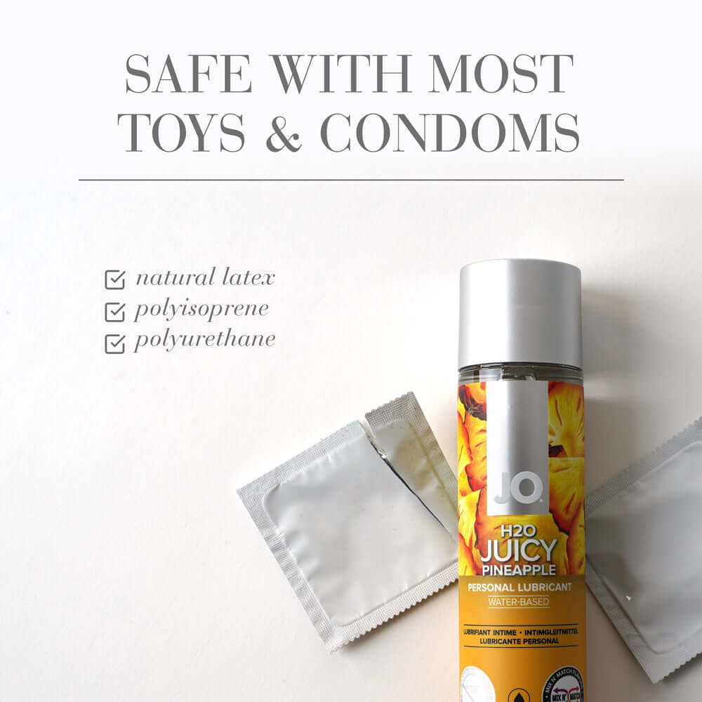 JO H2O Juicy Pineapple Flavored Water-Based Lubricant 4 Oz with condom wrappers and safety information.