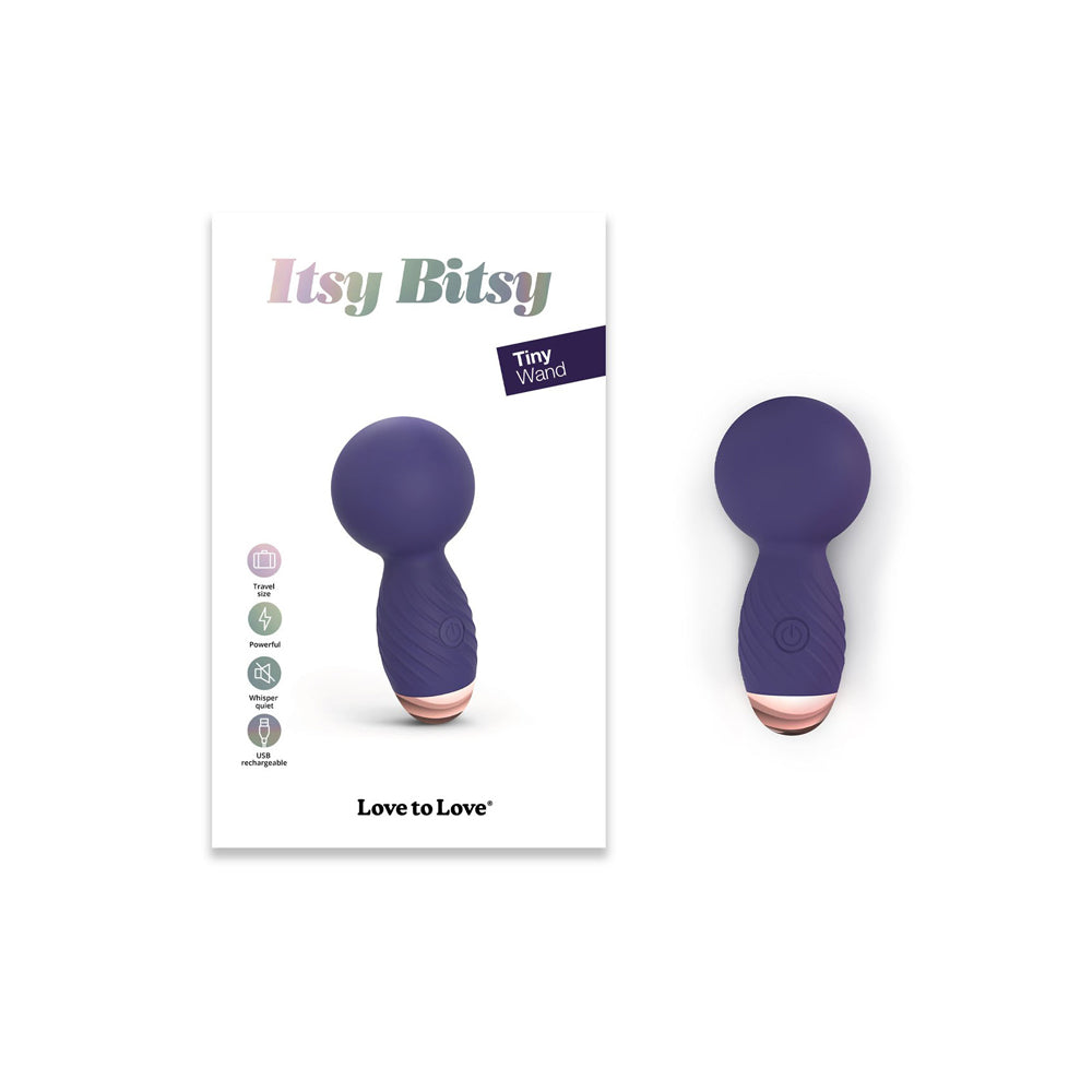 Love To Love Itsy Bitsy Midnight Indigo Vibrator with packaging, featuring a compact design and strong stimulation.