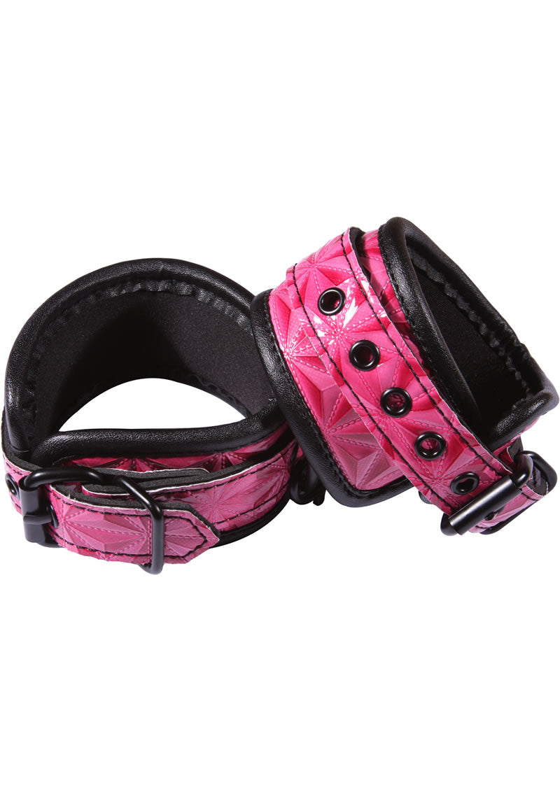 Sinful Adjustable Faux Leather Wrist Cuffs Pink, showcased with a quilted design and soft lining for comfort and style.