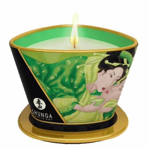 Shunga Massage Candle Zenitude Exotic Green Tea 5.7 Oz lit with green wax in decorative container.