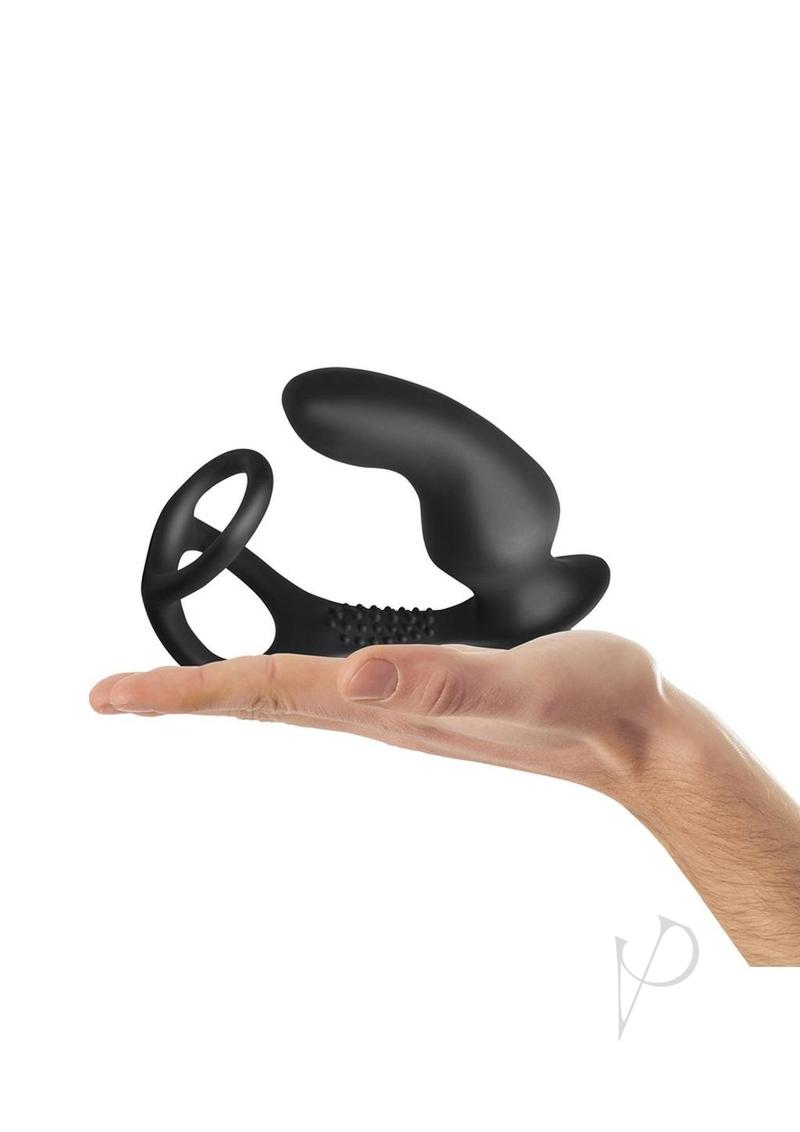 Ro-Zen Pro Silicone Cock Ring Vibrating Butt Plug Black held in hand, showcasing its dual-action design and silicone material.