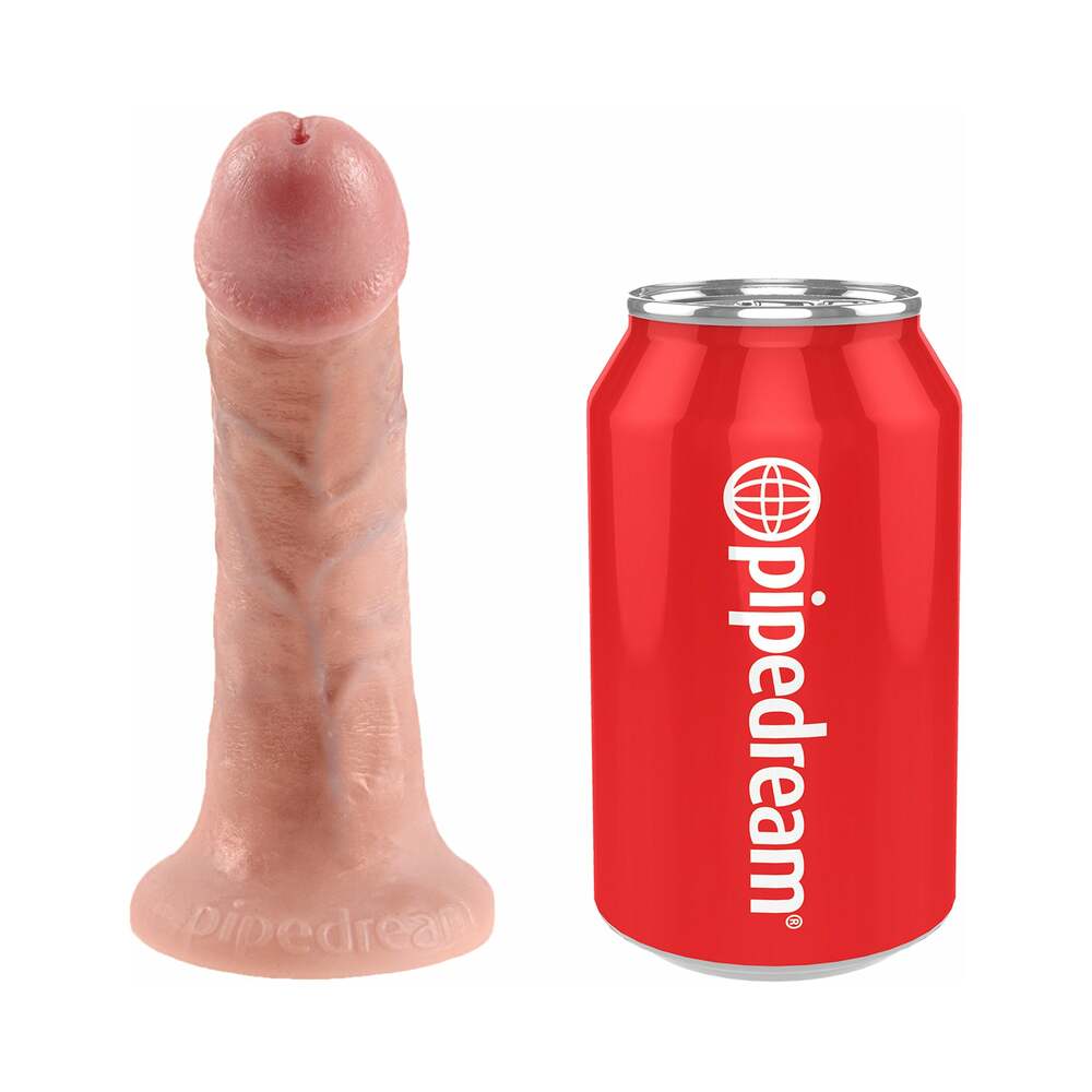 King Cock Strap-On Harness With 6 inches Cock Beige next to a soda can for size comparison.