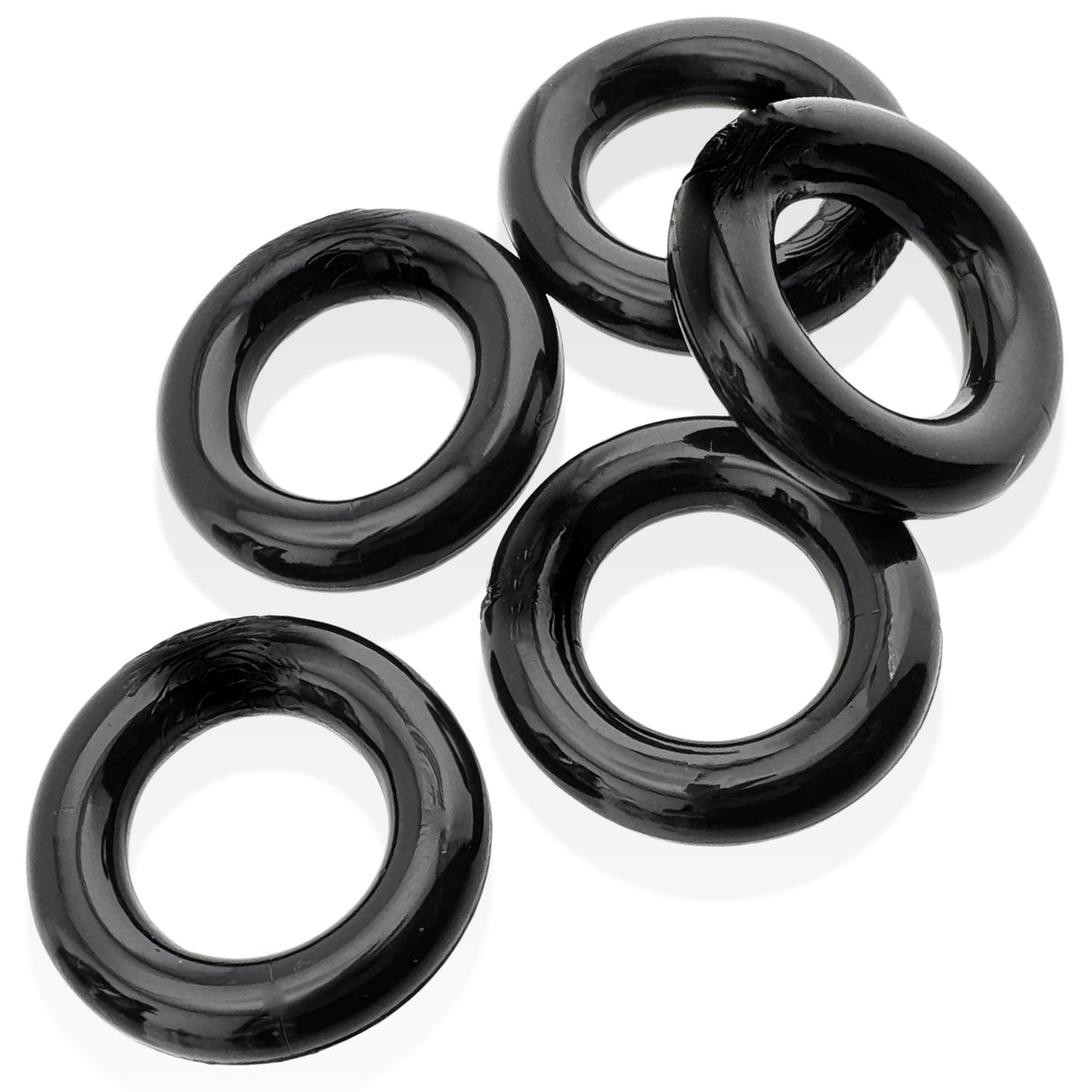 Oxballs Jacker 5-Stack Five-Pack Tube Super-Strong Cockrings Black in a set of five rubbery black cockrings.
