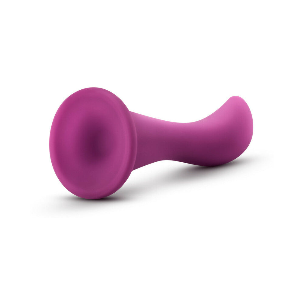 Blush Temptasia Bellatrix 6.25 inches Curved Dildo Plum in smooth purple silicone design.