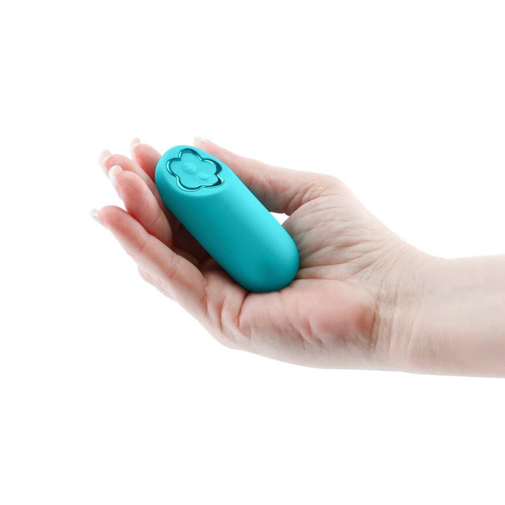 Sugar Pop Harmony Rechargeable Mini Vibrator Teal held in a hand, compact and discreet for travel.