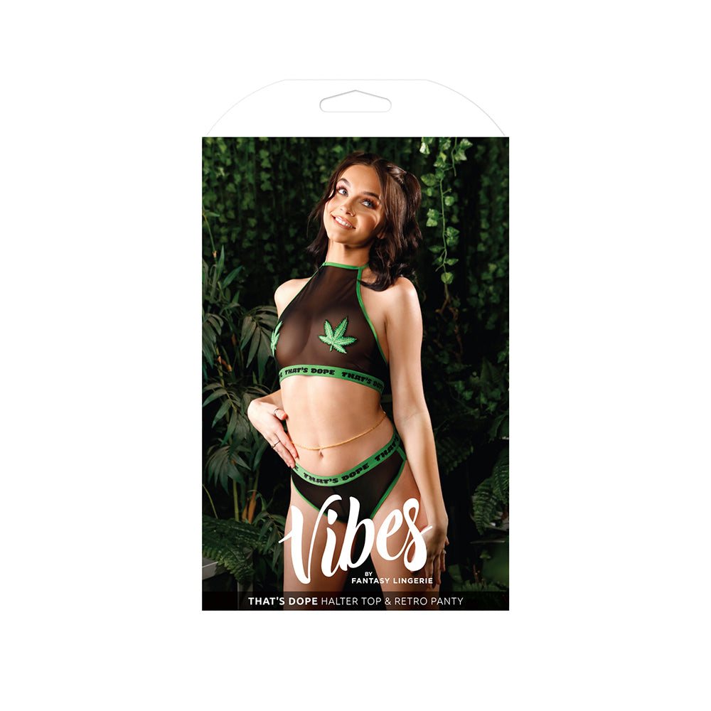That's Dope Halter Top and Retro Panty Set M/L Black on a model in a vibrant green setting, showcasing bold lingerie style.