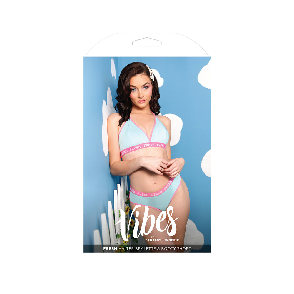 Vibes Fresh Halter Bralette & Booty Short Light Blue displayed on a model against a blue background.