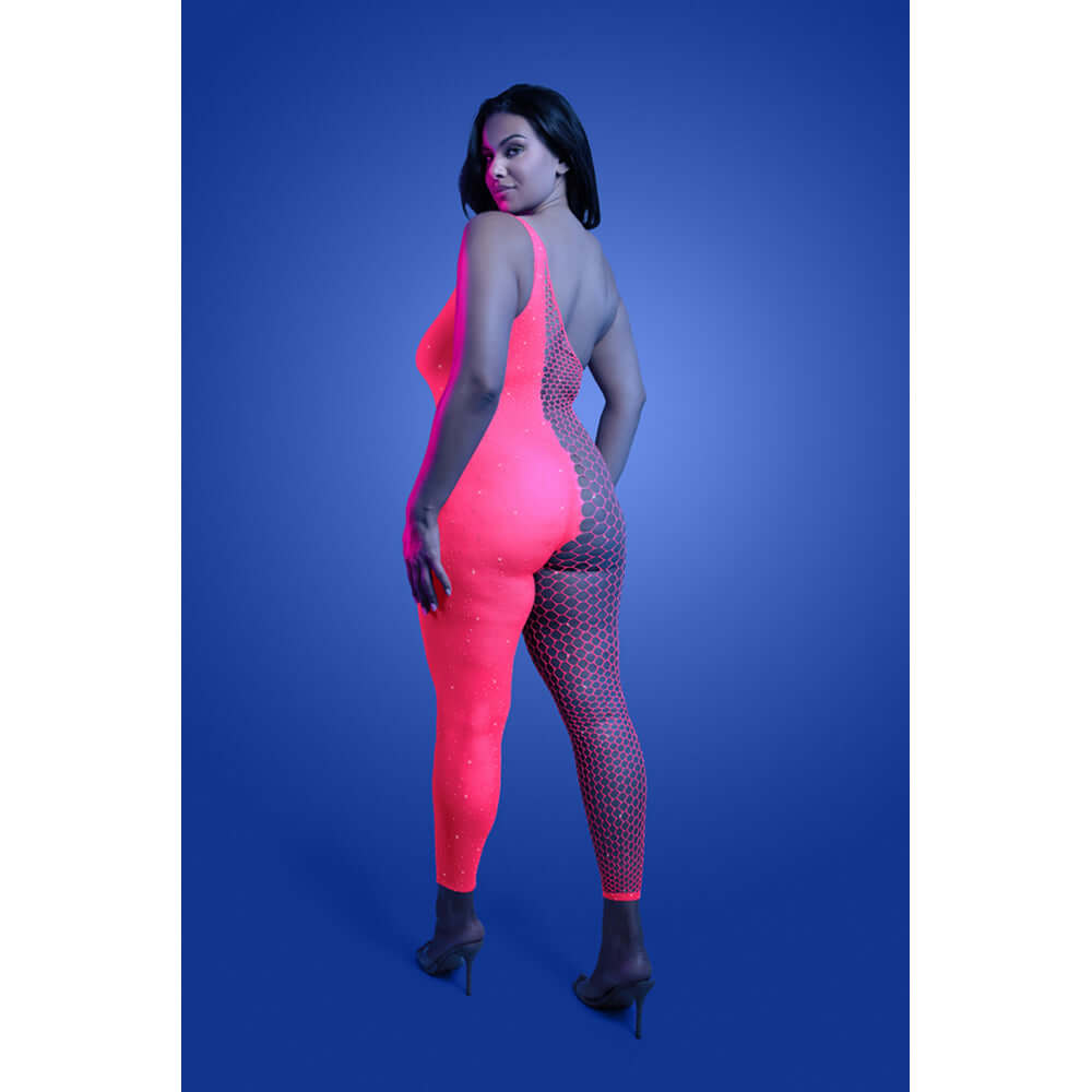 Model wearing Fantasy Lingerie Hyperdrive Rhinestone Bodystocking Queen Size in a UV reactive design with a vibrant glow.