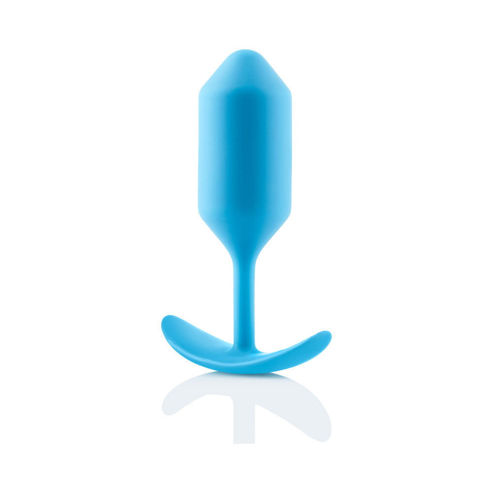 b-Vibe Snug Plug 3 Weighted Silicone Anal Plug Teal placed on a reflective surface.