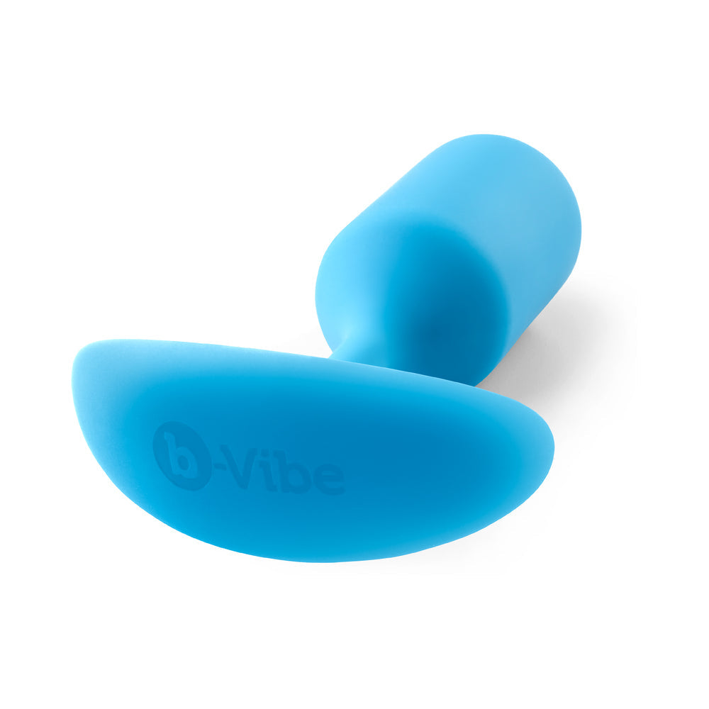 b-Vibe Snug Plug 3 Weighted Silicone Anal Plug Teal showcasing its ergonomic design and soft texture