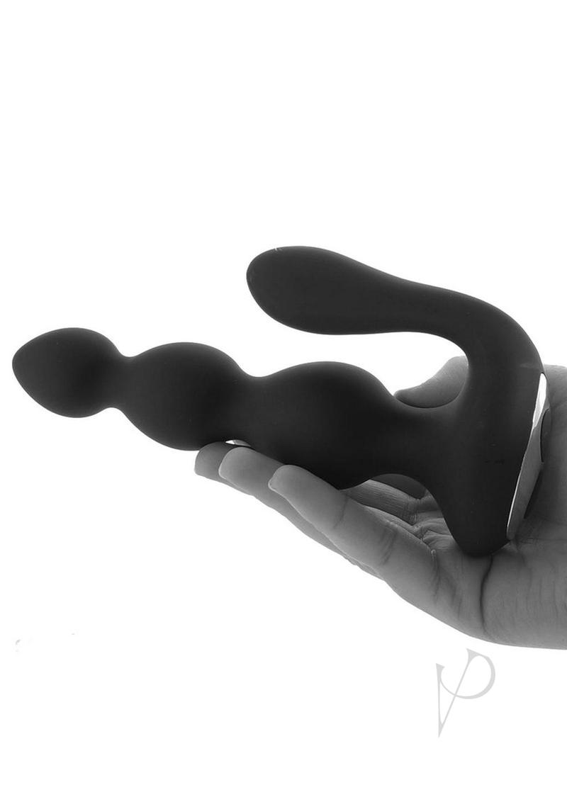 Butts Up Prostate Stimulator with Remote Control Black in hand showcasing its ergonomic design and dual motors.