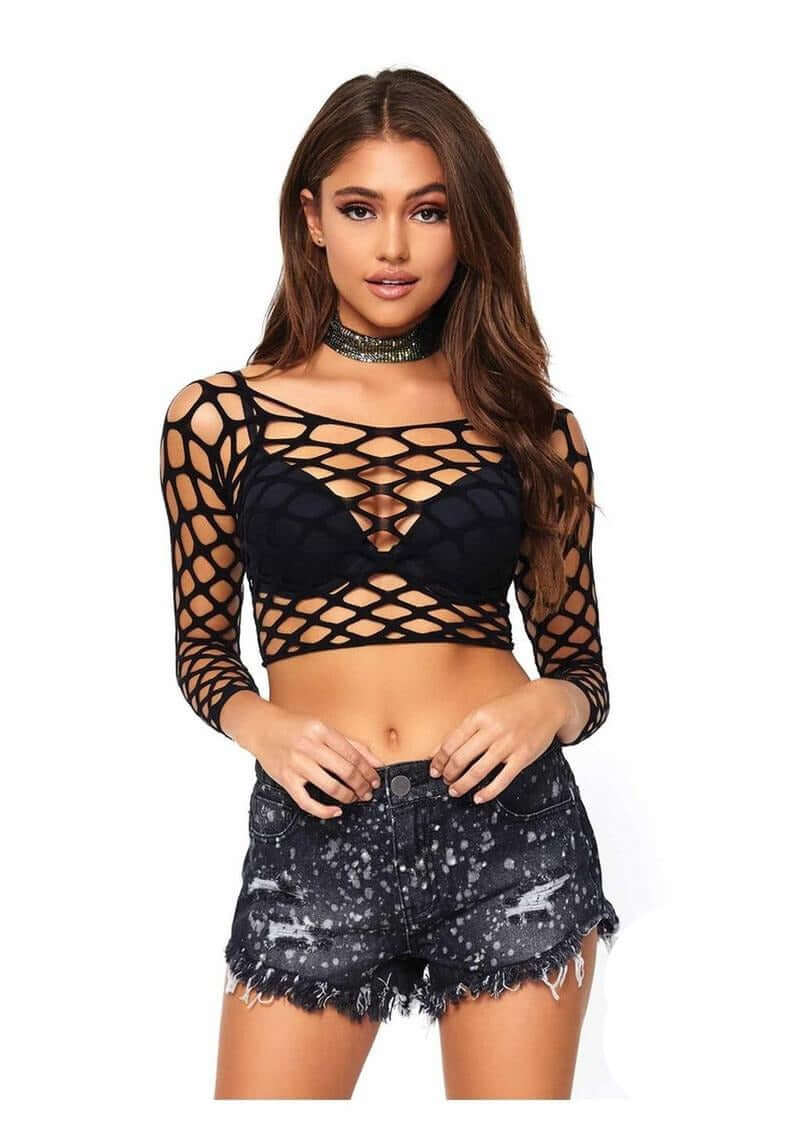 Leg Avenue Pothole Net Long Sleeved Crop Top OS Black worn with distressed shorts, showcasing a bold fishnet style.