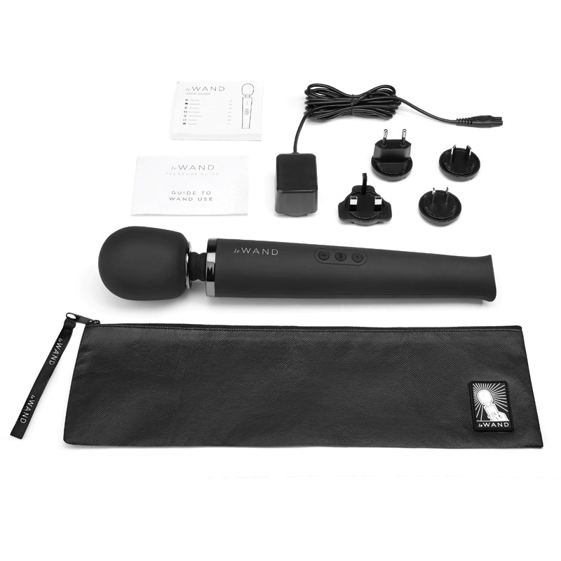 Le Wand Rechargeable Massager Black with accessories including charger, guide, and storage case.