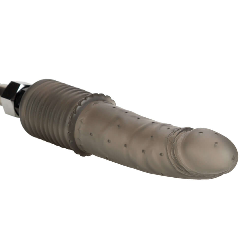 Colt Shower Shot Clear Anal Douche nozzle on a black background, showing its textured design for enhanced stimulation.