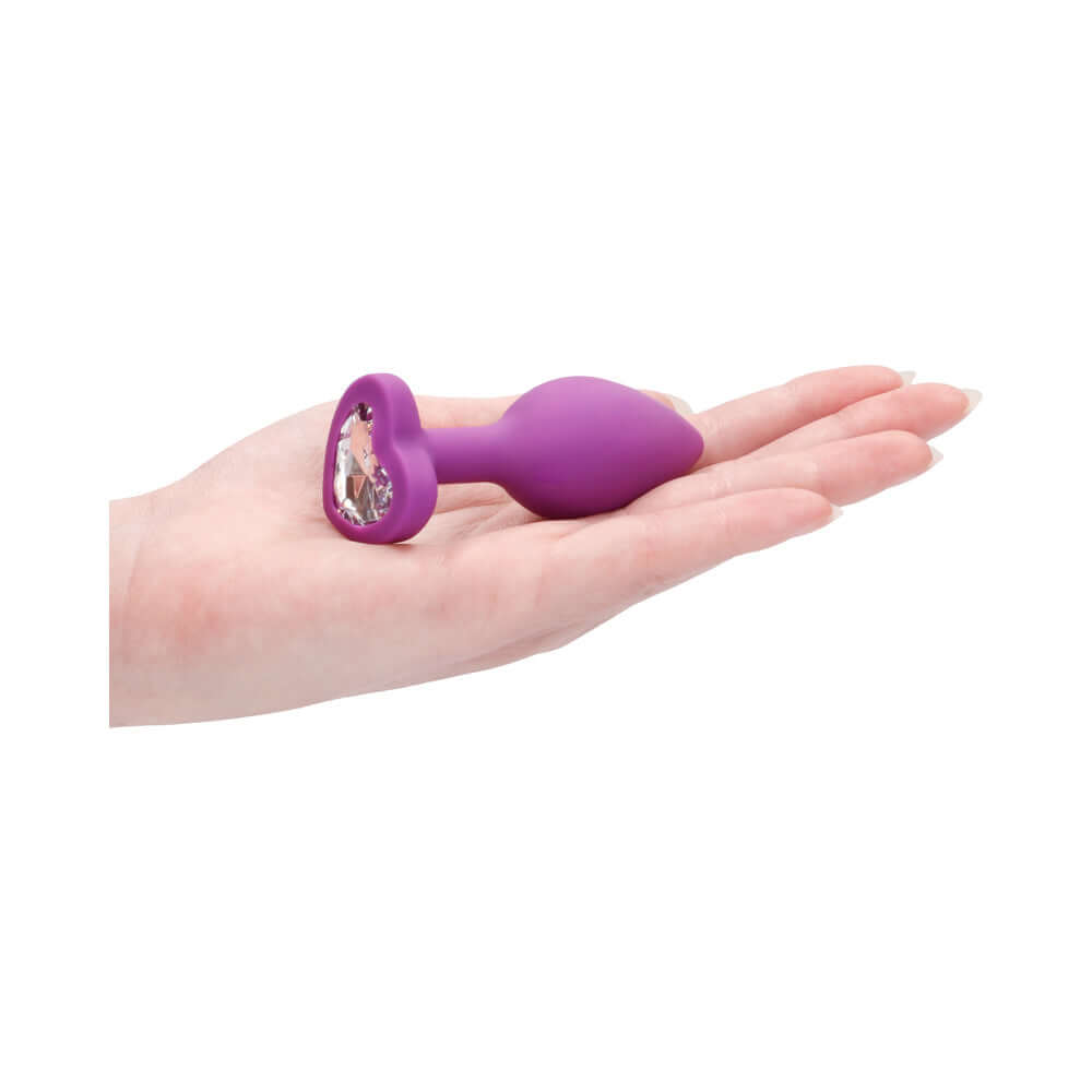 Flexible Silicone Diamond Heart Butt Plug Purple Regular held in hand to show size and design.
