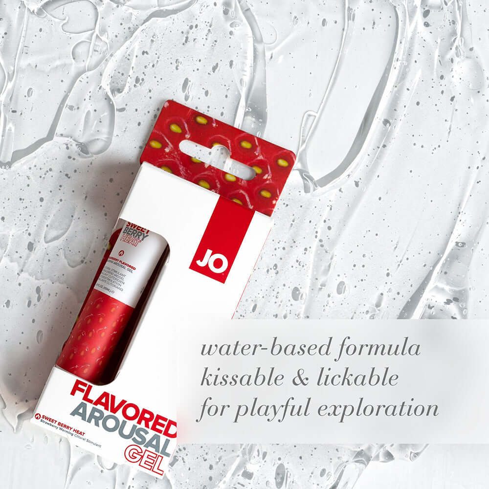 JO Sweet Berry Heat Flavored Arousal Gel 0.34 Oz packaging on a water-splattered background.