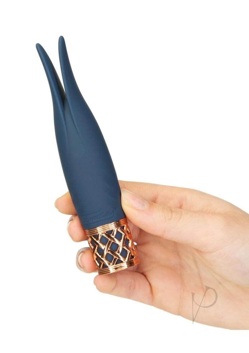 Pillow Talk Secrets Playful Rechargeable Massager Blue held in hand, showcasing its elegant design and playful flexible rabbit ear tips.