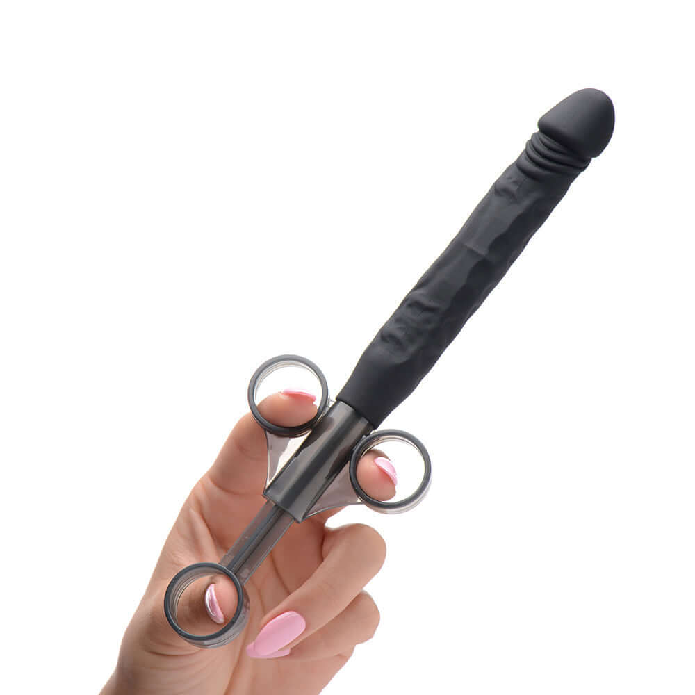 Master Series Jizz Shooter Silicone Dildo Lube Launcher held in hand, showcasing ergonomic design and silicone shaft.