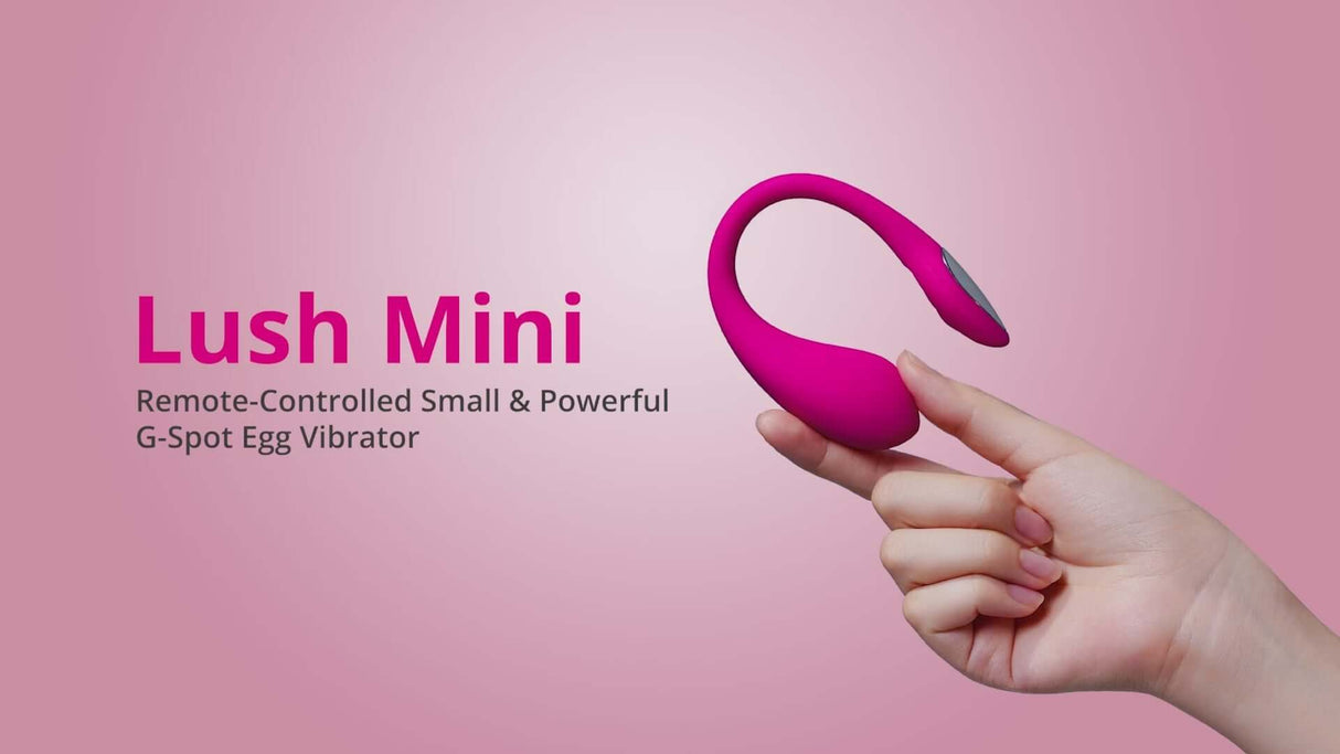 Lovense Lush Mini G-spot Egg Vibrator held in hand with pink background, showcasing its remote-controlled features.