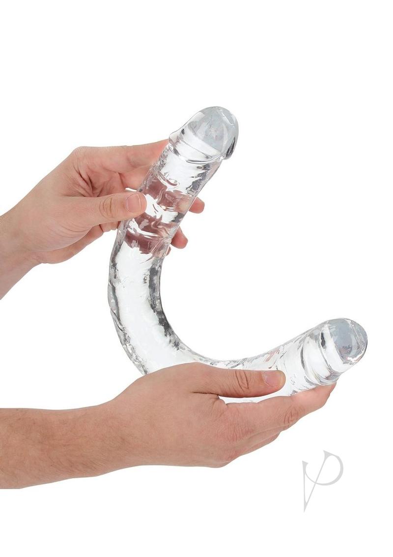 RealRock Crystal Clear Double Dong 18 inch Clear being held, showcasing its transparent design and dual ends.