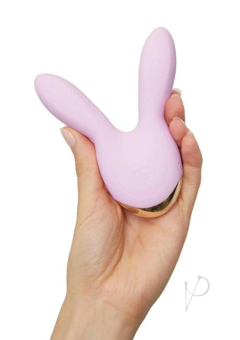 Hear Me Baby Silicone Clitoral Stimulator Baby Pink held in hand, showcasing its playful design and powerful features.
