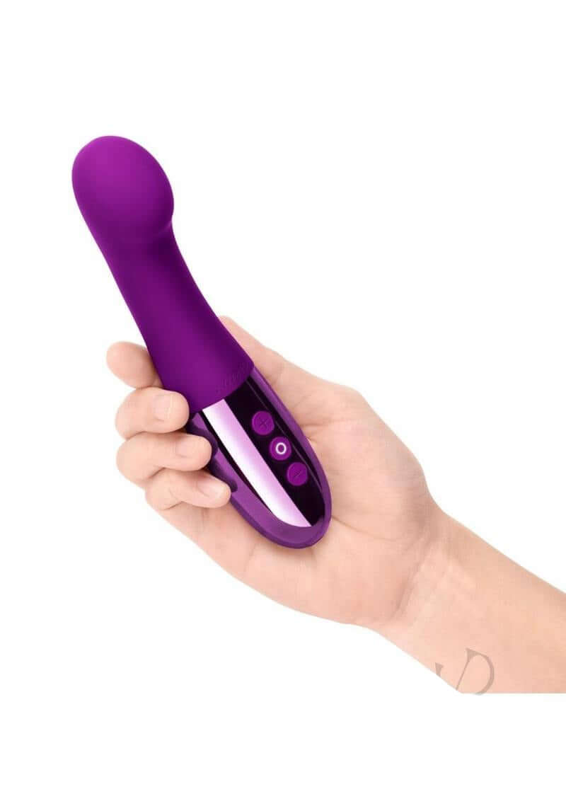 Le Wand Gee Rechargeable Body G-Spot Vibrator Cherry in a hand showcasing its flexible design and control buttons.