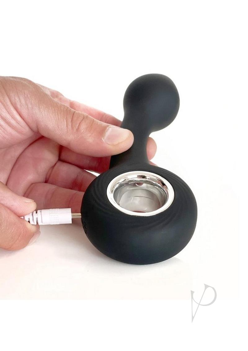 Vers G-Spot Rechargeable Silicone Vibrator Black being charged, showcasing its sleek design for pleasurable use.
