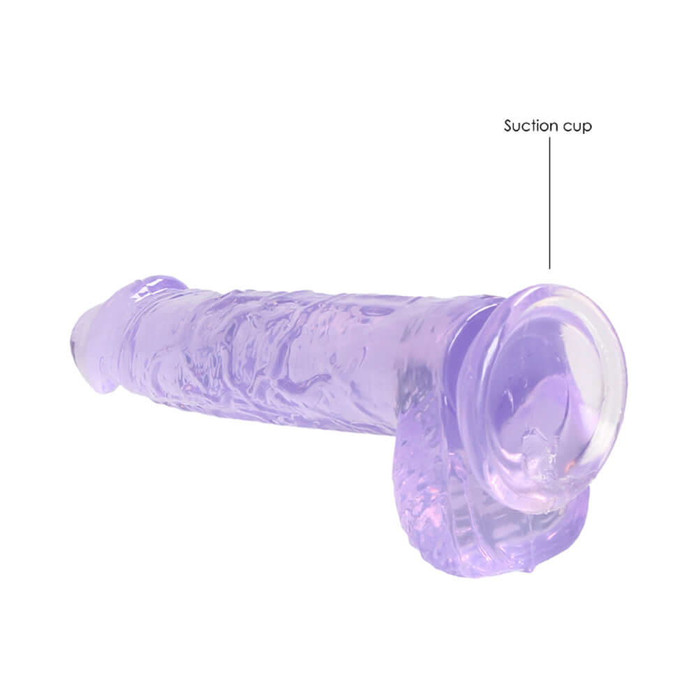 RealRock Crystal Clear Realistic 6 inch Dildo With Balls Purple featuring a suction cup for stability.