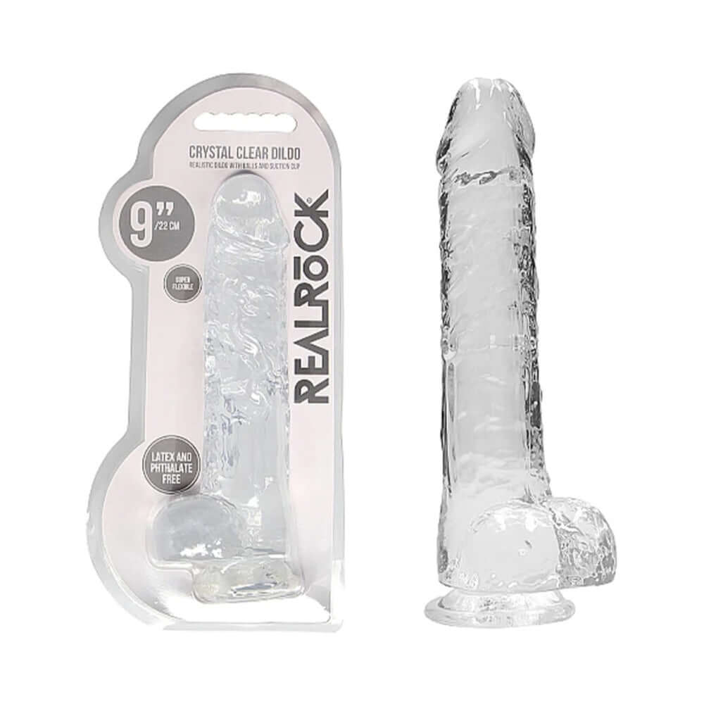 RealRock Crystal Clear Realistic 9 inch Dildo With Balls Clear in packaging and displayed, showing its crystal clear design.