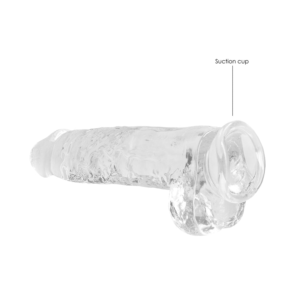 RealRock Crystal Clear Realistic 9 inch Dildo With Balls Clear featuring a textured surface and suction cup for stability.