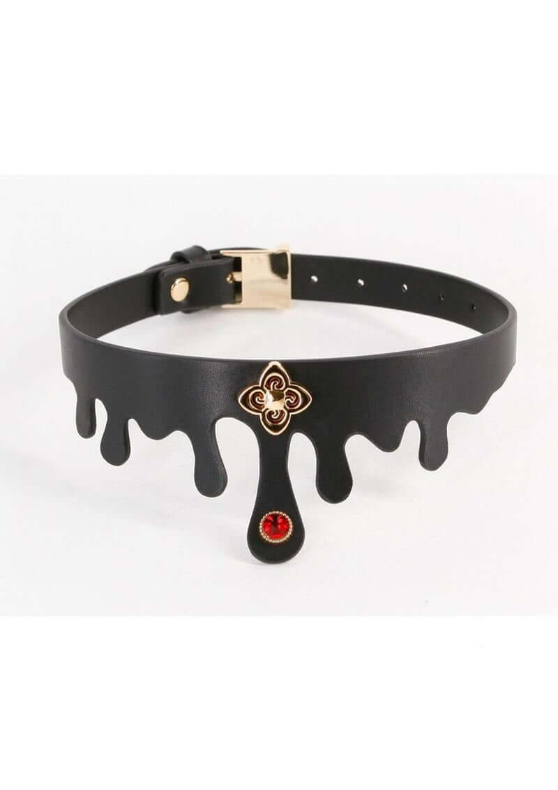 Fetish & Fashion Elvira Collar Black Gold with a ruby jewel and gold charm, designed for alluring bondage.