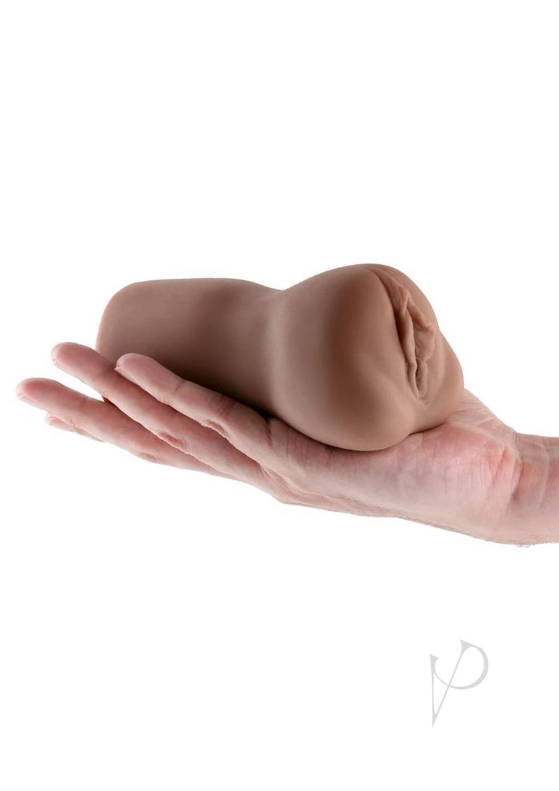 Barely Legal Raven Stroker Closed End Masturbator Pussy in a hand showcasing its compact design.