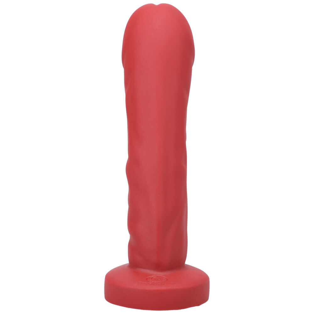 Tantus Grind Silicone Dildo True Blood Red offering a lifelike sensation and satisfying fullness for pleasure.