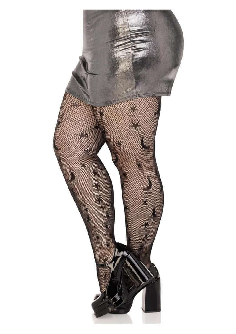 Leg Avenue Celestial Net Tights 1X 2X Black worn with a metallic skirt and high-heeled shoes, showcasing a celestial pattern.