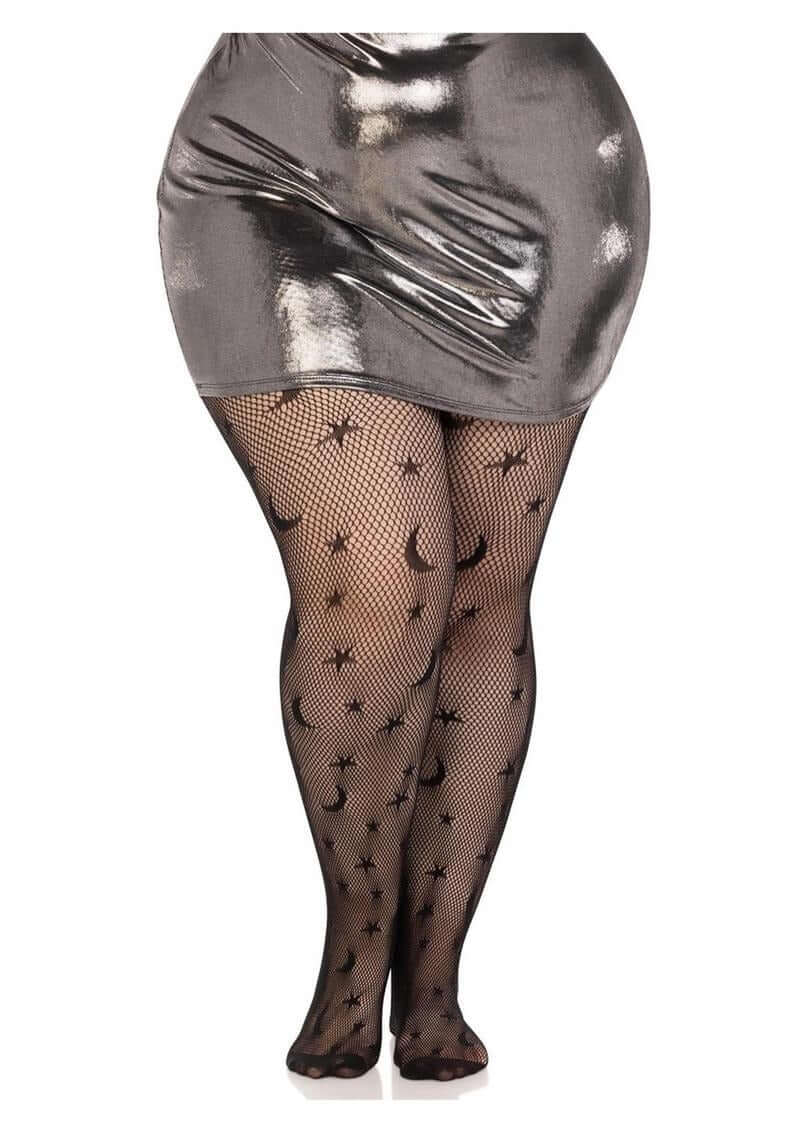 Leg Avenue Celestial Net Tights 1X 2X Black worn with a shiny silver mini skirt, featuring celestial patterns of stars and moons.