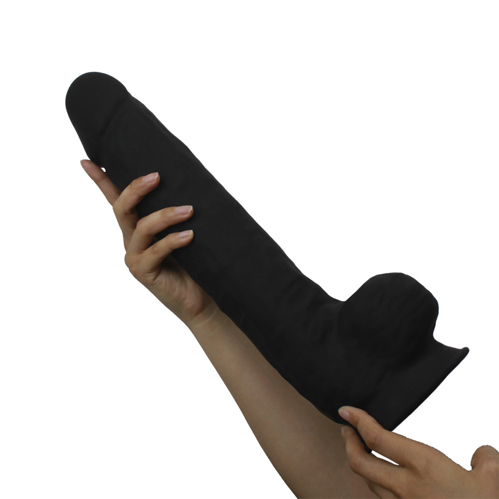 Silex-d The Original Model 1 Dildo 15 inches Black held in a hand, showcasing its length and dual-density silicone design.