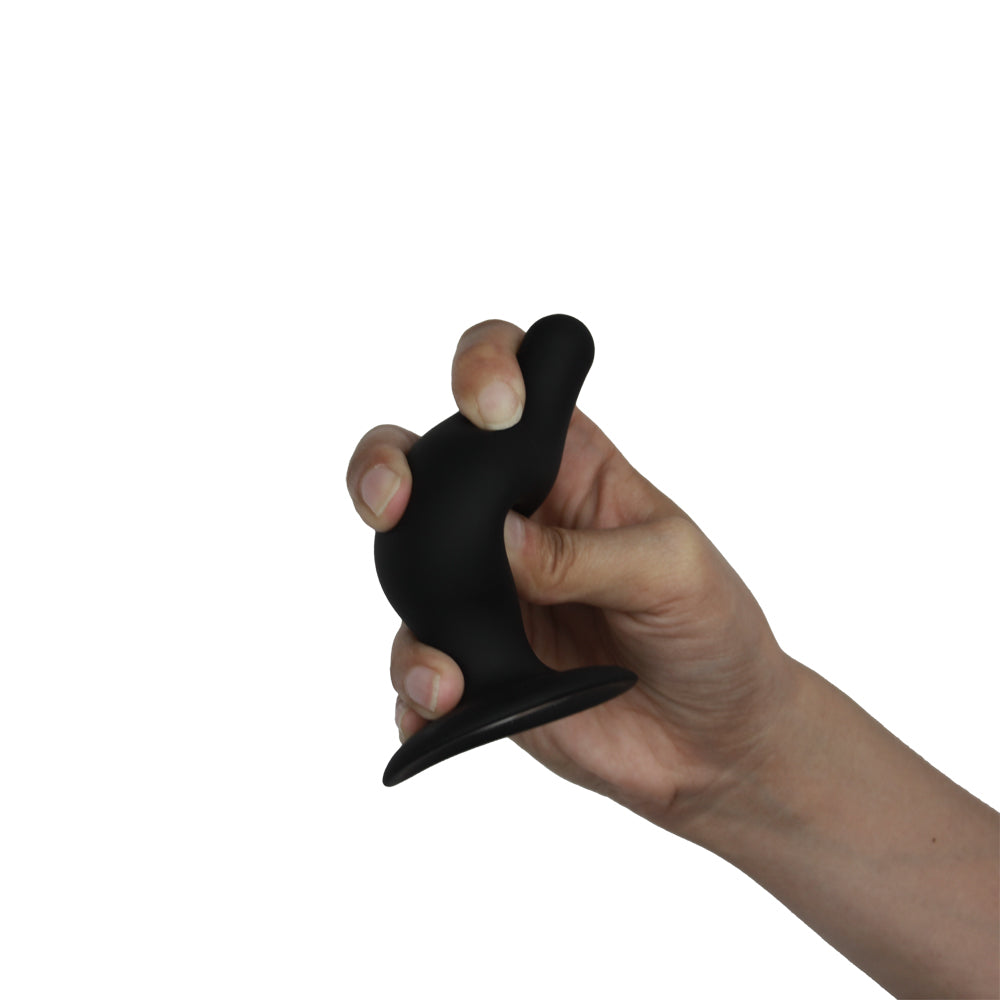 Hand holding Silex-d The Original Plug Model 2 Dildo 3.5 inch M Black for anal pleasure.