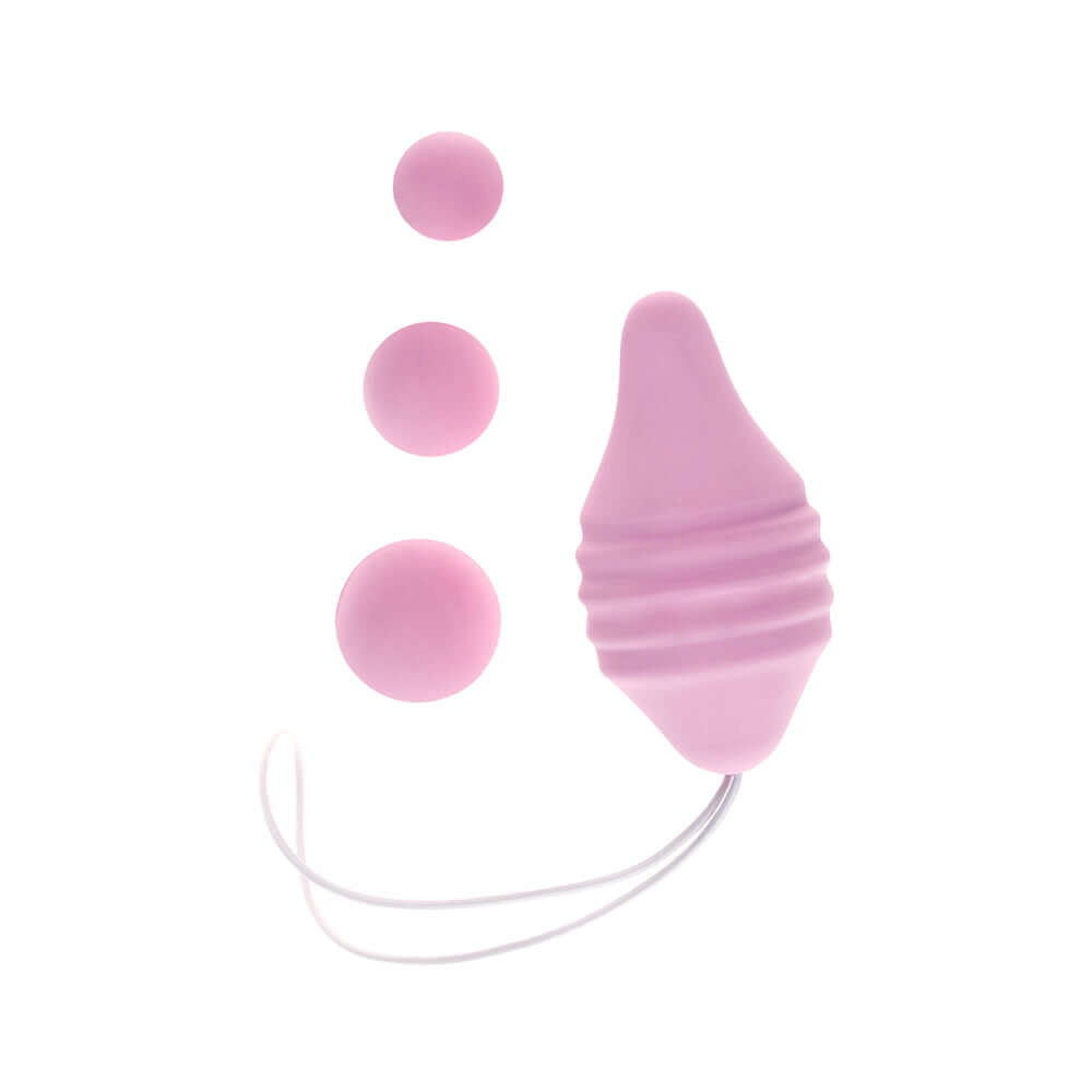 Femintimate Pelvix Silicone Kegel Exerciser Pink with interchangeable weights for pelvic floor strengthening.