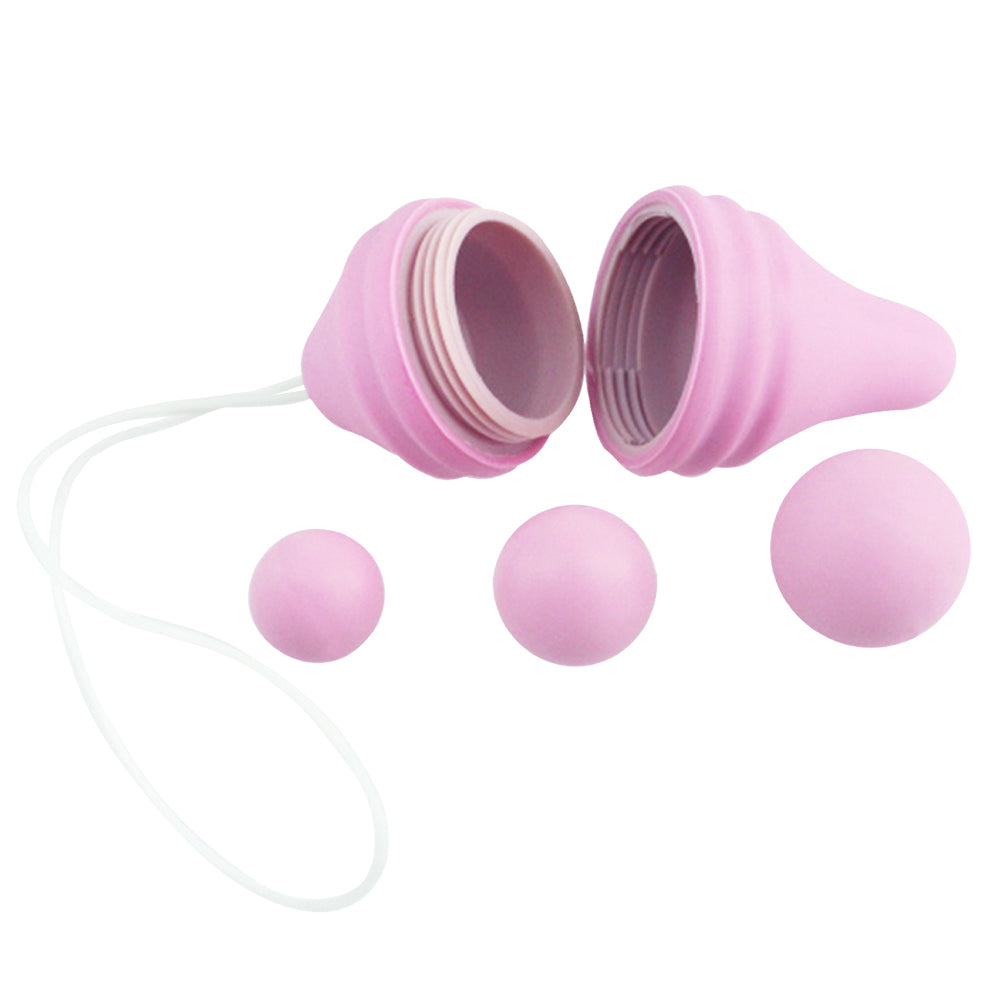 Femintimate Pelvix Silicone Kegel Exerciser Pink with interchangeable weights for pelvic floor strengthening.