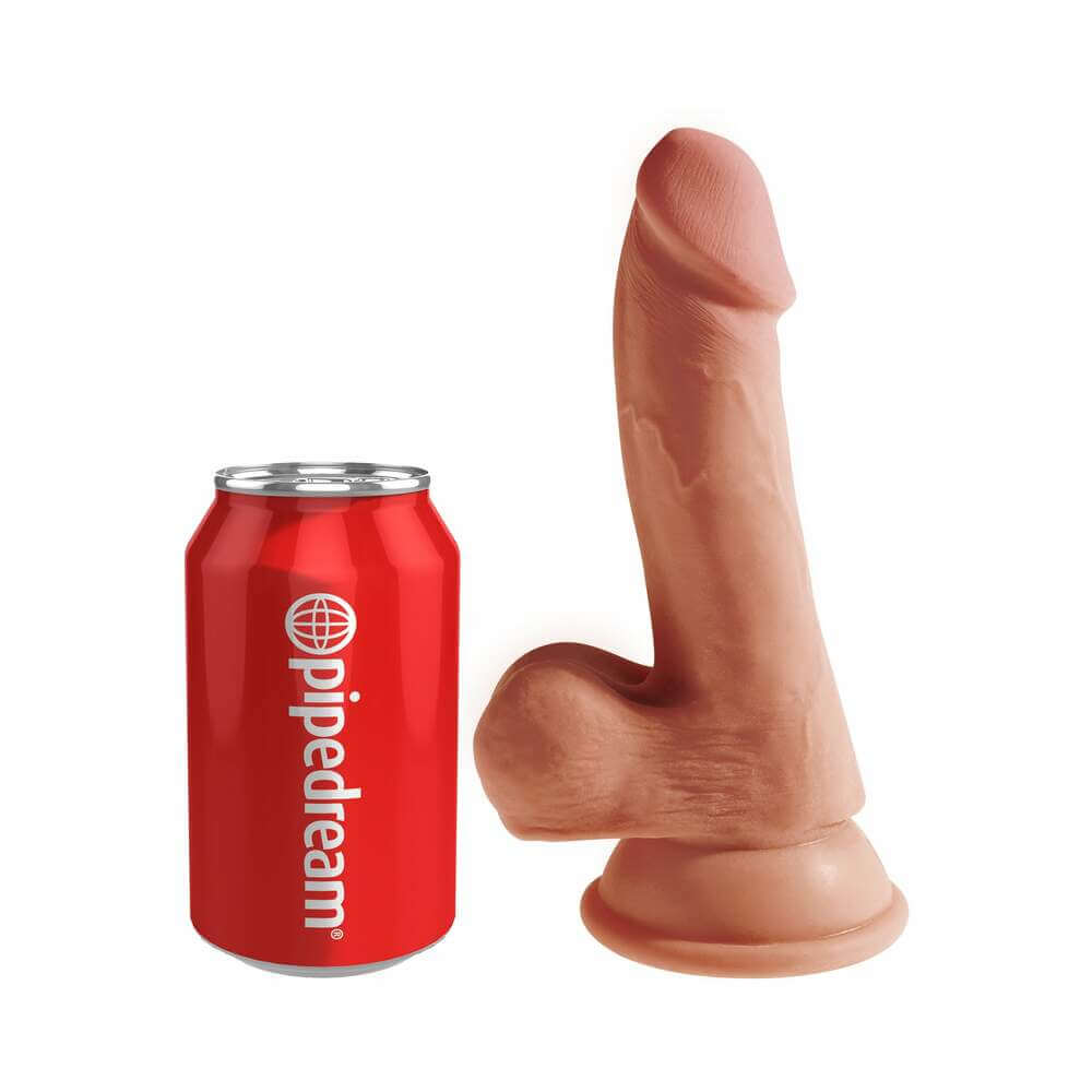 King Cock Plus 6.5 inch Triple Density Cock With Balls Tan next to a soda can for size comparison.