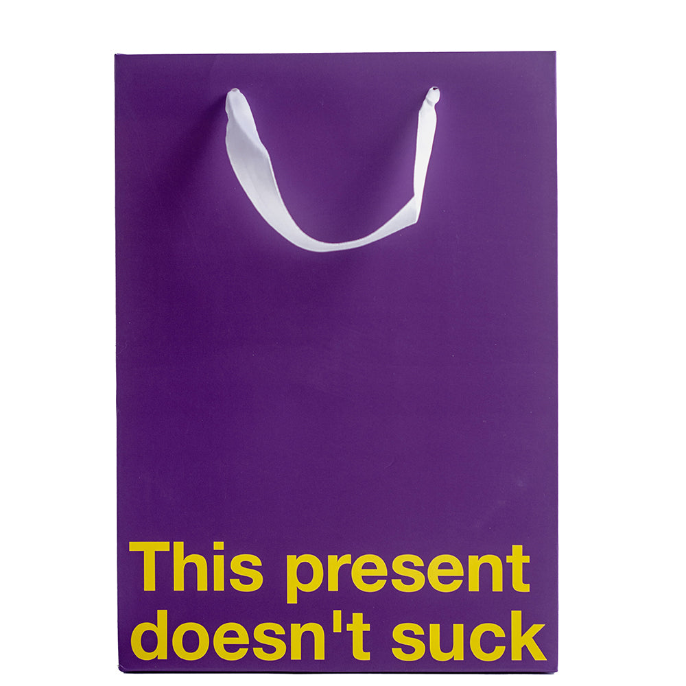 This Present Doesn't Suck Color Gift Bag Purple featuring a humorous design for Gift giving.