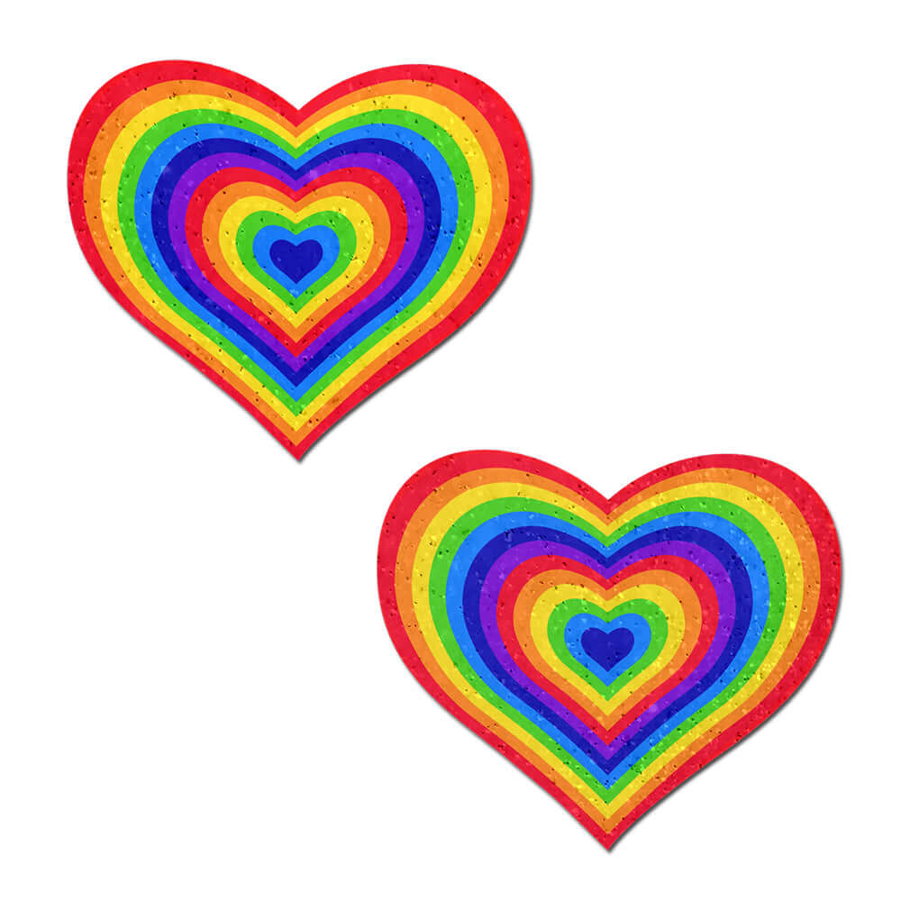 Pastease Love Velvet Rainbow Pumping Heart Nipple Pasties showcasing colorful heart designs with vibrant rainbow patterns.