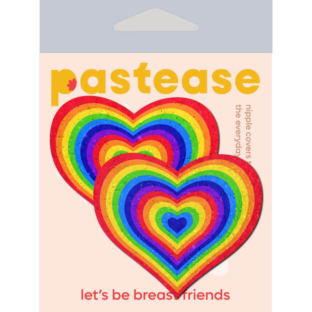 Pastease Love Velvet Rainbow Pumping Heart Nipple Pasties in vibrant colors on packaging background.