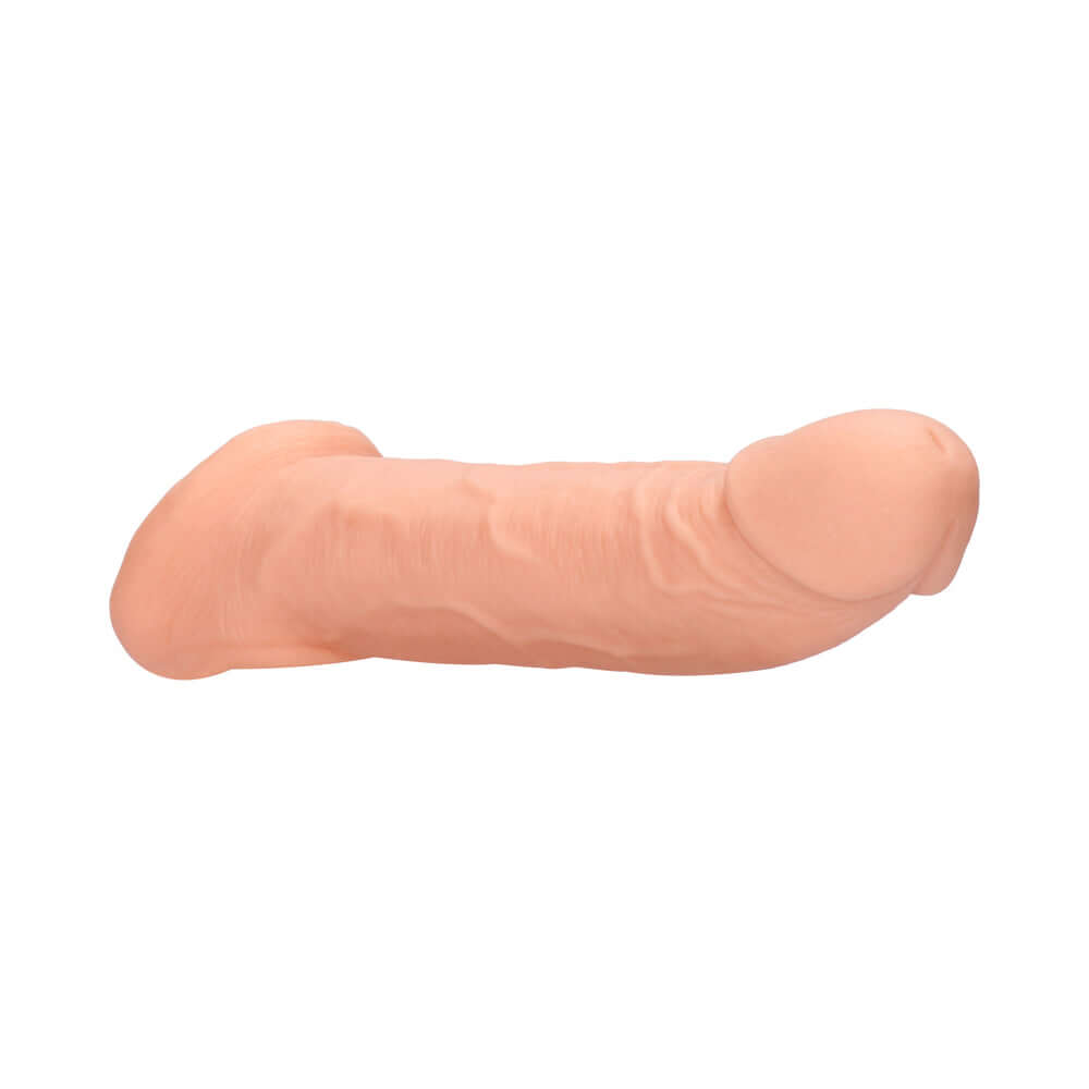 RealRock Realistic 9 inch Penis Sleeve Extender Sling Beige shown in a lifelike design and flesh-toned color.
